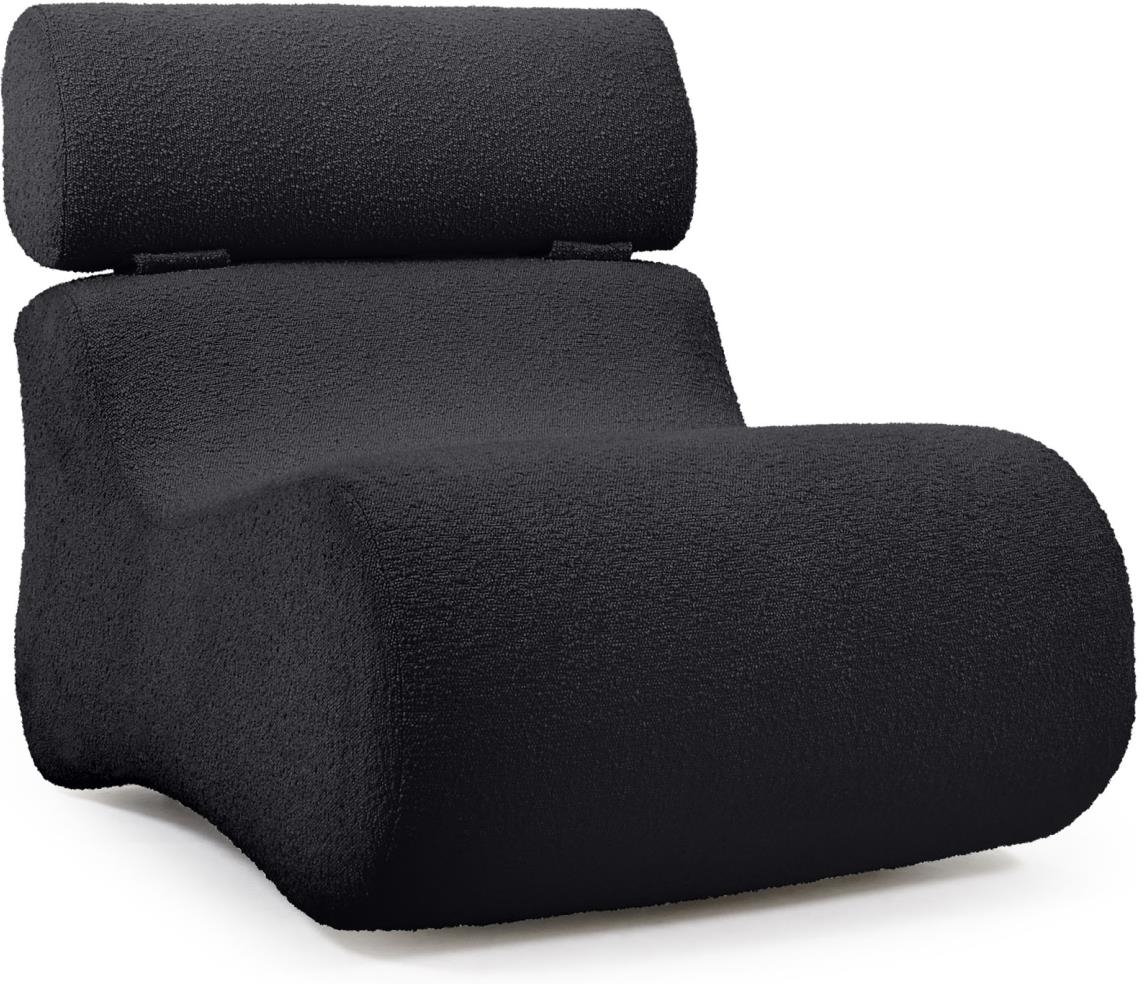 Moderne loungestol i sort shearling fra Kave Home